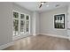 Bright bedroom with large windows and hardwood floors at 4633 W Lowell Ave, Tampa, FL 33629