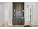 A beautiful built-in bar or display area with shelving and hardwood flooring at 4633 W Lowell Ave, Tampa, FL 33629