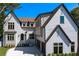Stunning two-story home with a modern farmhouse design and a white brick driveway at 4633 W Lowell Ave, Tampa, FL 33629