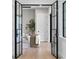 Elegant foyer with modern French doors leading into the living room at 4633 W Lowell Ave, Tampa, FL 33629