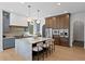Open kitchen with a marble island, stainless steel appliances, and modern pendant lighting at 4633 W Lowell Ave, Tampa, FL 33629