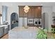 Bright kitchen with stainless steel appliances, granite countertops, and a large island at 4633 W Lowell Ave, Tampa, FL 33629