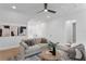 Bright living room featuring neutral tones, modern decor and a ceiling fan at 4633 W Lowell Ave, Tampa, FL 33629