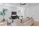 Spacious living room features hardwood floors, modern decor, and plenty of natural light at 4633 W Lowell Ave, Tampa, FL 33629
