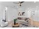 Bright living room featuring neutral tones, modern decor and a ceiling fan at 4633 W Lowell Ave, Tampa, FL 33629