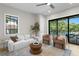 Bright living room with contemporary furniture and a sliding glass door to the outdoor patio at 4633 W Lowell Ave, Tampa, FL 33629