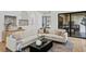 Comfortable living space with sectional sofa, stylish accents, and seamless access to the outdoor living area at 4633 W Lowell Ave, Tampa, FL 33629