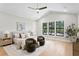 A beautiful main bedroom featuring a ceiling fan and black trimmed windows at 4633 W Lowell Ave, Tampa, FL 33629