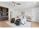 A spacious main bedroom featuring a ceiling fan and hardwood flooring at 4633 W Lowell Ave, Tampa, FL 33629