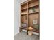 Mudroom with custom wood shelving, a built-in bench, and stylish decorative accents at 4633 W Lowell Ave, Tampa, FL 33629