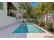 Backyard swimming pool and spa with white pavers and a covered porch at 4633 W Lowell Ave, Tampa, FL 33629