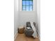 Cozy nook with chair, side table, window and hardwood flooring at 4633 W Lowell Ave, Tampa, FL 33629