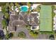 Luxury waterfront home boasting a pool, tennis court, and stunning bay views at 5031 W San Miguel St, Tampa, FL 33629