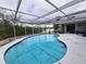 Another view of the pool, highlighting the canal view and pool shape at 6496 Fairway View S Blvd, St Petersburg, FL 33707