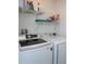 Laundry room with washer, dryer and shelving at 6820 Aramon Ct, Wesley Chapel, FL 33545