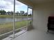 Peaceful screened patio overlooking a tranquil lake at 6820 Aramon Ct, Wesley Chapel, FL 33545