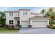 Two-story house with two-car garage and attractive landscaping at 10573 Bridgegate Heights Loop, San Antonio, FL 33576