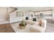 Spacious living room with sectional sofa and kitchen view at 10573 Bridgegate Heights Loop, San Antonio, FL 33576