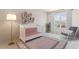 Charming Bedroom with crib, rocking chair, and ample natural light at 10573 Bridgegate Heights Loop, San Antonio, FL 33576