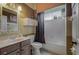 Small bathroom with single vanity, toilet, and tub at 10645 Plantation Bay Dr, Tampa, FL 33647