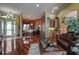 Bright and airy living room with hardwood floors and a leather couch at 10645 Plantation Bay Dr, Tampa, FL 33647