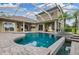 Large screened in pool and spa with patio area at 10645 Plantation Bay Dr, Tampa, FL 33647