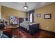 Bedroom with full bed, hardwood floors, and large window at 10645 Plantation Bay Dr, Tampa, FL 33647