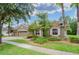 House exterior showcasing a two-car garage and landscaping at 10645 Plantation Bay Dr, Tampa, FL 33647