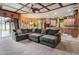 Open living room showcasing a large sectional sofa and adjacent kitchen at 10645 Plantation Bay Dr, Tampa, FL 33647