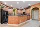 Spacious kitchen featuring an island, ample cabinetry, and granite countertops at 10645 Plantation Bay Dr, Tampa, FL 33647