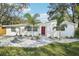 Charming single story home with white exterior and landscaping at 1505 Cedar St, Safety Harbor, FL 34695