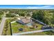 An aerial shot showcasing the backyard of a property, complete with a pool, trampoline, and playset at 15272 Spinning Wheel Ln, Brooksville, FL 34604