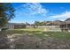 Large fenced backyard with a storage shed, playset, pool and patio for relaxing and entertaining at 15272 Spinning Wheel Ln, Brooksville, FL 34604