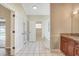 Bright bathroom with a double-door entry and an alcove tub at 15272 Spinning Wheel Ln, Brooksville, FL 34604
