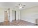 Bedroom featuring wood-look floors, neutral walls, and closet at 15272 Spinning Wheel Ln, Brooksville, FL 34604