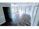 Spacious bedroom featuring a ceiling fan, hardwood floors, and two closets at 15272 Spinning Wheel Ln, Brooksville, FL 34604