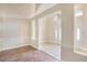 Open-concept space with wood floors flowing into a tiled entry, creating a seamless transition and welcoming feel at 15272 Spinning Wheel Ln, Brooksville, FL 34604