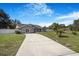 Well-maintained single-Gathering home with manicured lawn and lengthy driveway at 15272 Spinning Wheel Ln, Brooksville, FL 34604