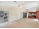 Expansive living space connected to kitchen and secondary seating area with tiled flooring throughout at 15272 Spinning Wheel Ln, Brooksville, FL 34604