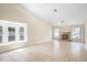 Spacious living room featuring a fireplace, tiled floors, and a window seat for natural light at 15272 Spinning Wheel Ln, Brooksville, FL 34604