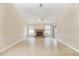 Spacious living room features a fireplace, tiled floors, and large windows for lots of light at 15272 Spinning Wheel Ln, Brooksville, FL 34604