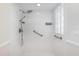 Handicap accessible shower with glass block window for natural light at 15272 Spinning Wheel Ln, Brooksville, FL 34604