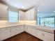 Spacious kitchen with white cabinets, a large island, and stainless steel appliances at 29456 Velletri Ln, Wesley Chapel, FL 33543