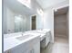 Modern bathroom with double vanity, quartz countertop and walk-in shower at 29456 Velletri Ln, Wesley Chapel, FL 33543