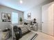 Charming bedroom with gray walls, striped bedding, and plenty of storage at 29456 Velletri Ln, Wesley Chapel, FL 33543