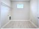 Laundry room with tile floor, shelving, and hookups at 29456 Velletri Ln, Wesley Chapel, FL 33543