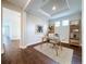 Bright home office with hardwood floors and built-in shelving at 29456 Velletri Ln, Wesley Chapel, FL 33543