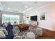 Spacious living room featuring hardwood floors and ample natural light at 29456 Velletri Ln, Wesley Chapel, FL 33543