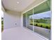 Covered patio with sliding glass doors leading to the backyard at 29456 Velletri Ln, Wesley Chapel, FL 33543