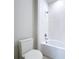Simple bathroom with white toilet and bathtub at 29456 Velletri Ln, Wesley Chapel, FL 33543